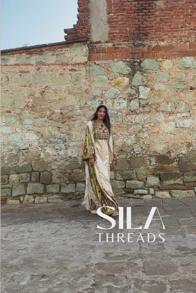 Video of palestinian thobe worn by women with a bridal palestinian veil. Customizable piece